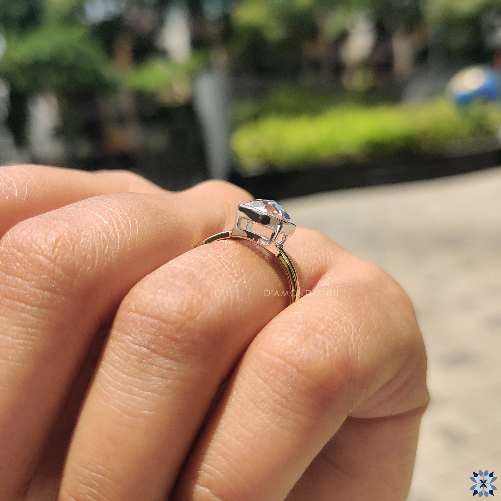 UK engagement ring with round rose cut Moissanite and minimalist bezel design.