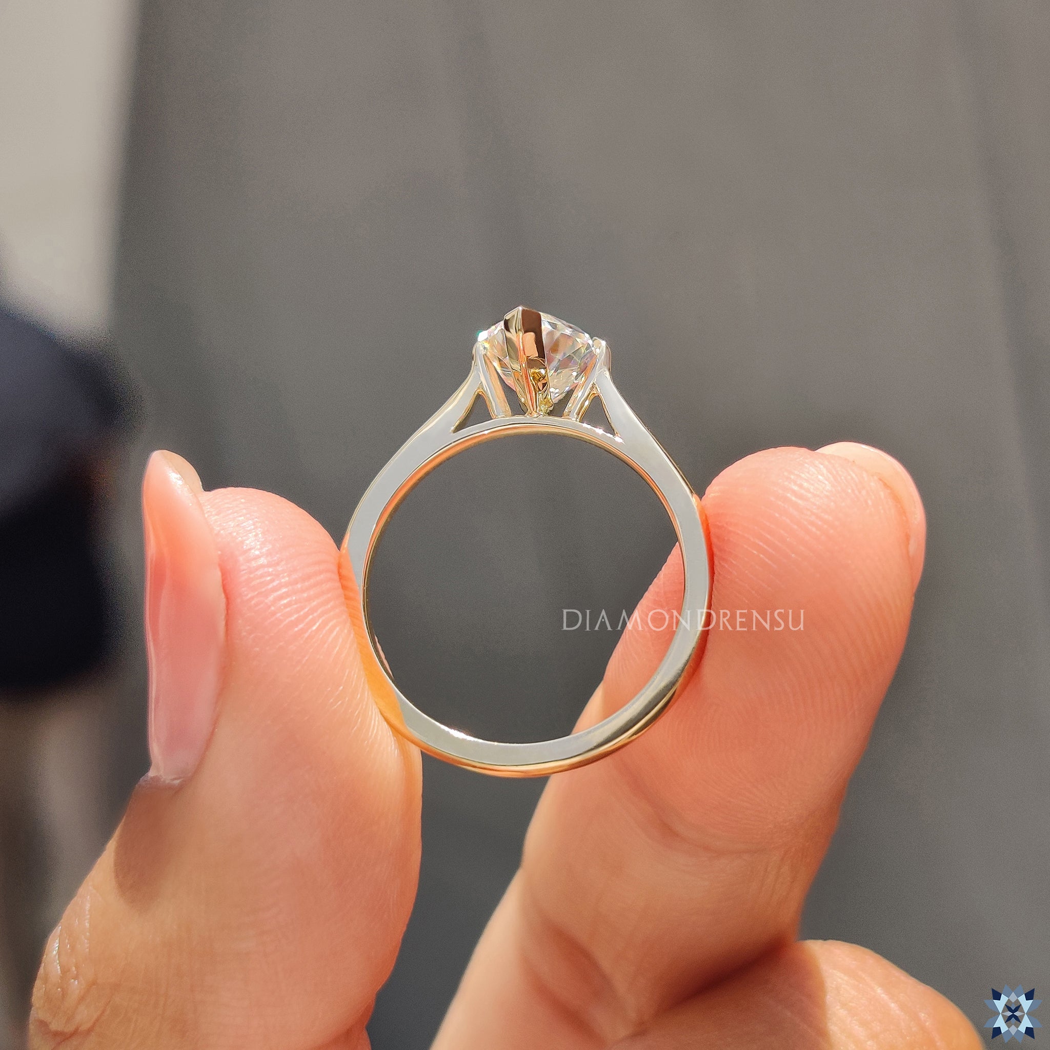 Elegant UK engagement ring with Dutch marquise moissanite in claw prong setting.