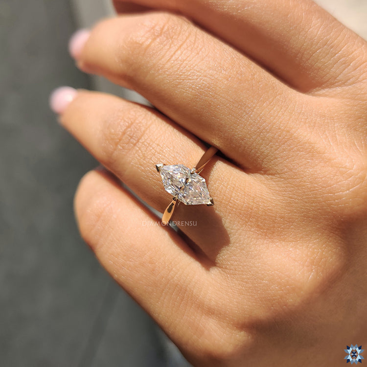 Cathedral setting Dutch marquise engagement ring by Diamondrensu UK.