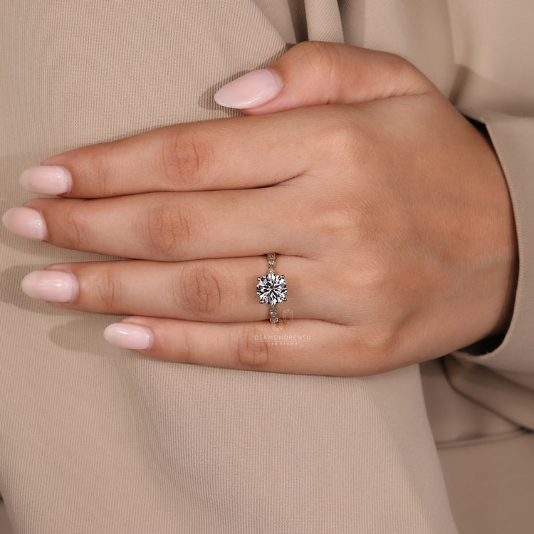 Unique ring with milgrain and 4 prong details.