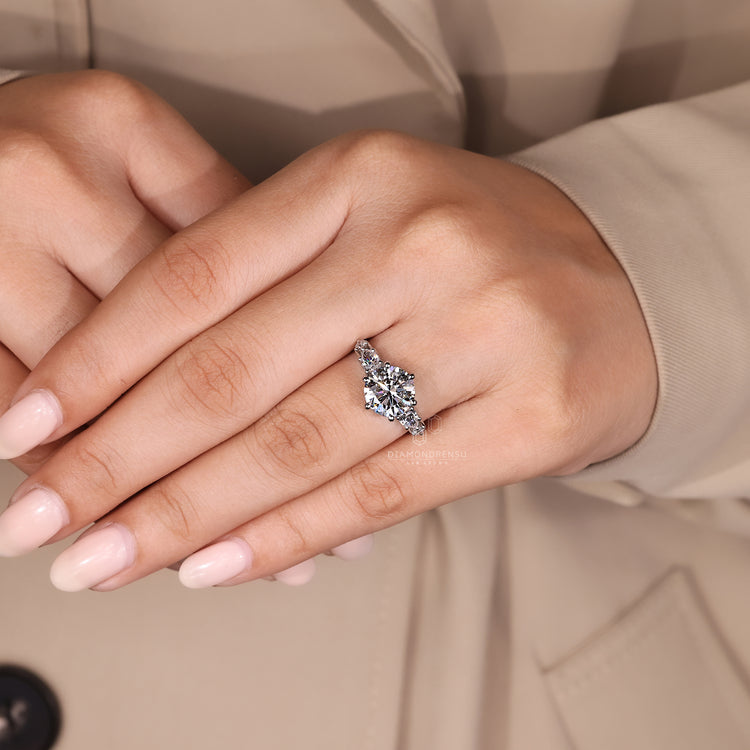 Custom engagement ring with round and pear design.