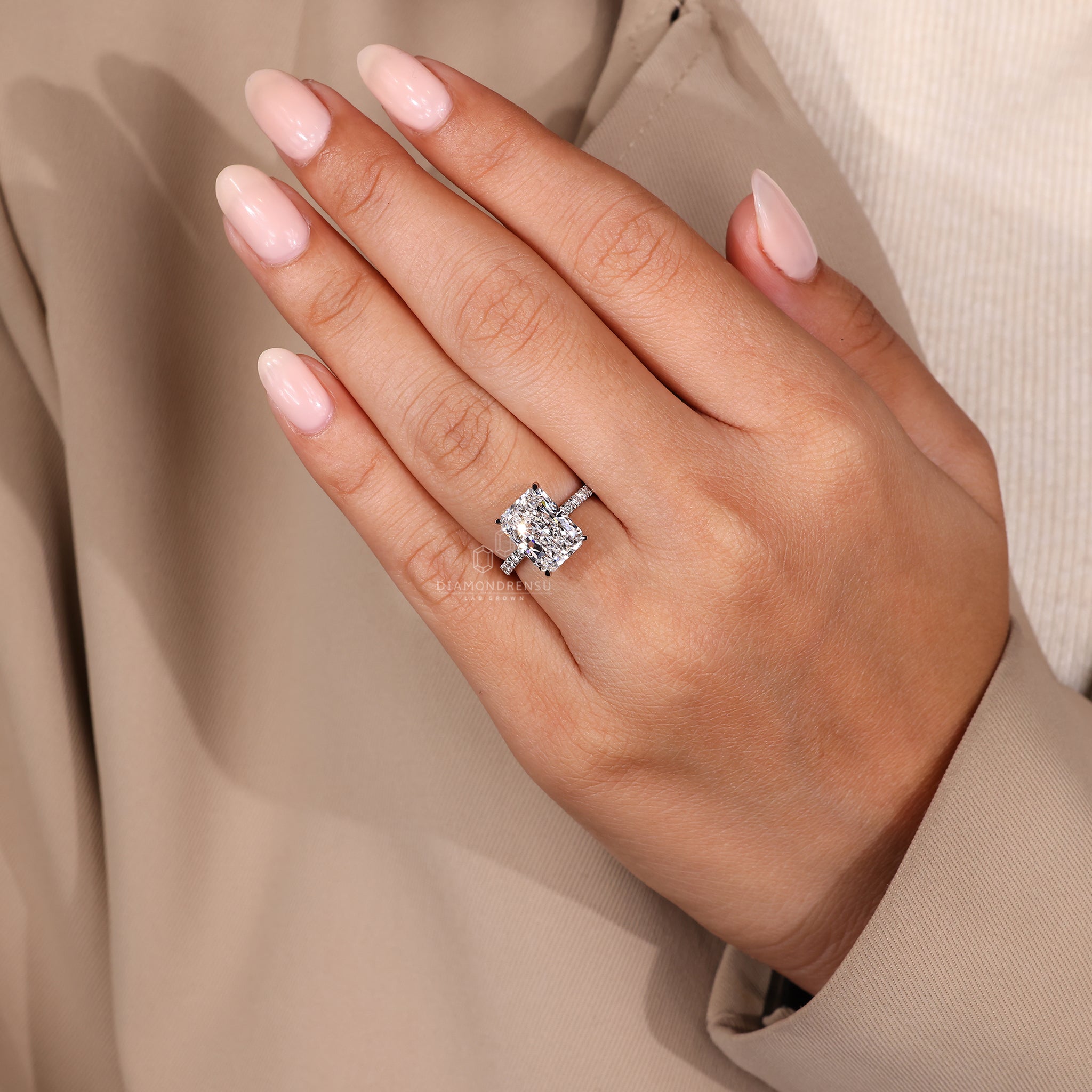 Round diamond ring designed with white gold metal.