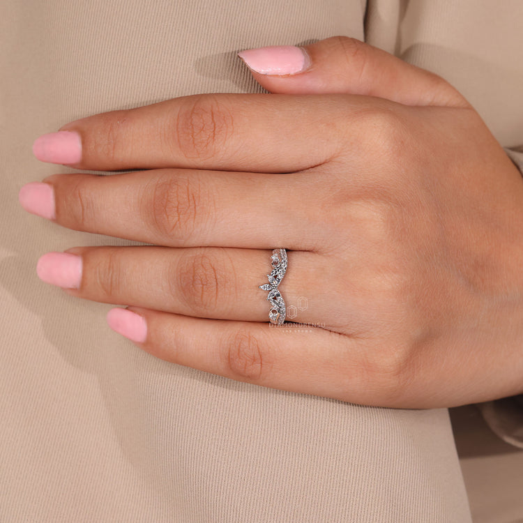 White gold band with round and marquise diamonds.