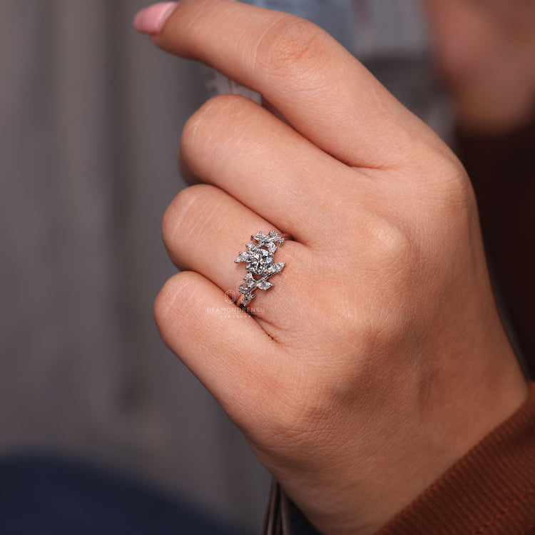 Round cut diamond engagement ring with four prongs.