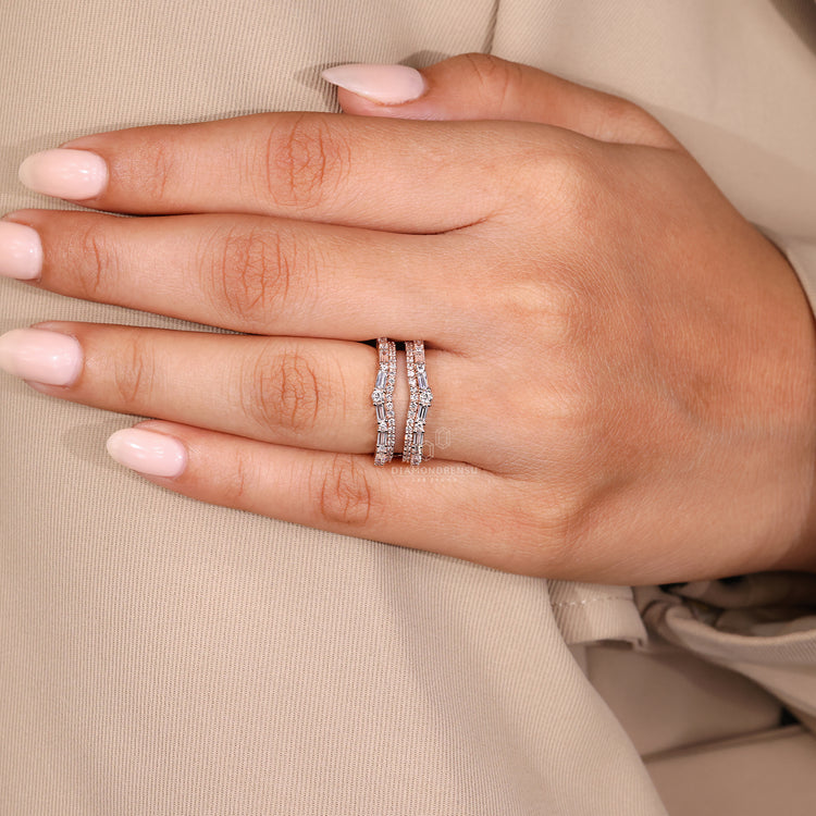 Prong set wedding band with baguette and round diamonds.