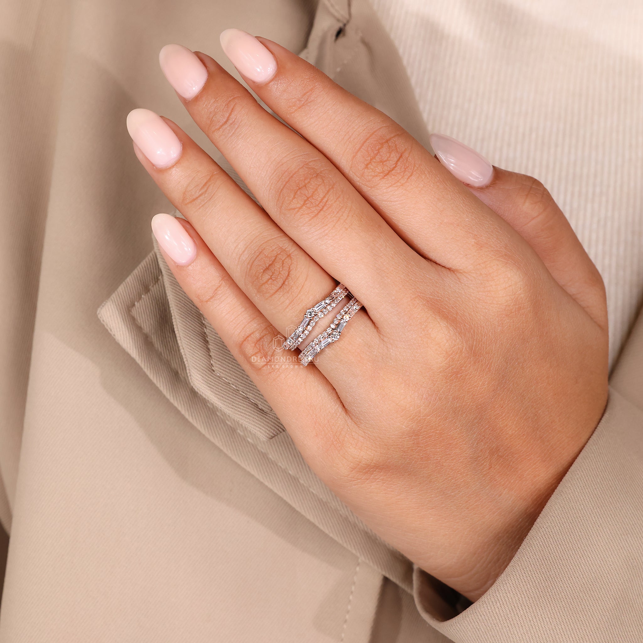 Handmade ring with baguette and round diamond layout.