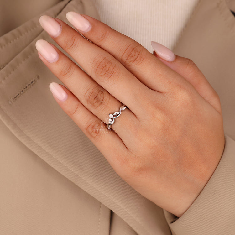 Round cut moonstone diamond with cluster setting.