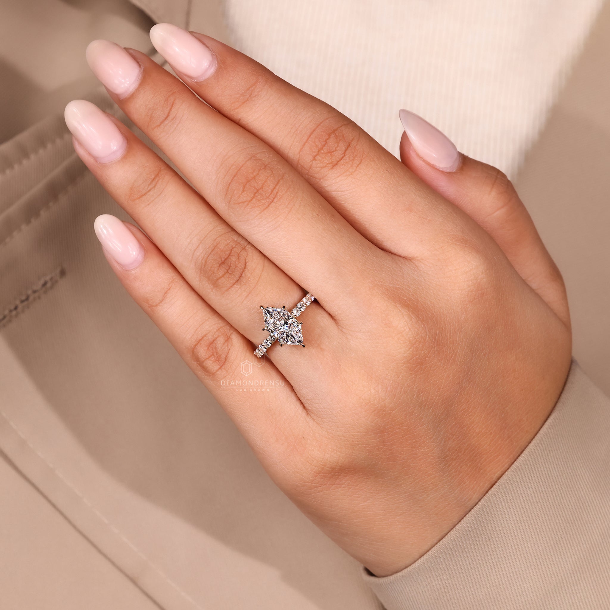 Round engagement ring with hidden halo design