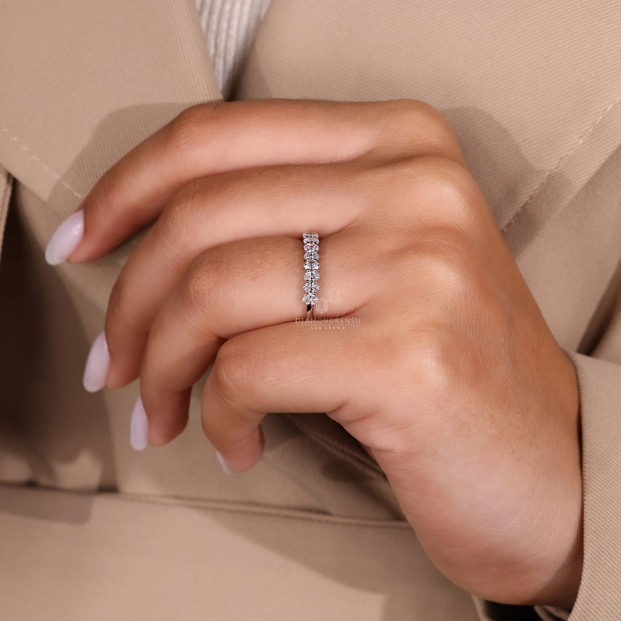 Simple wedding band in white gold with a half eternity layout.