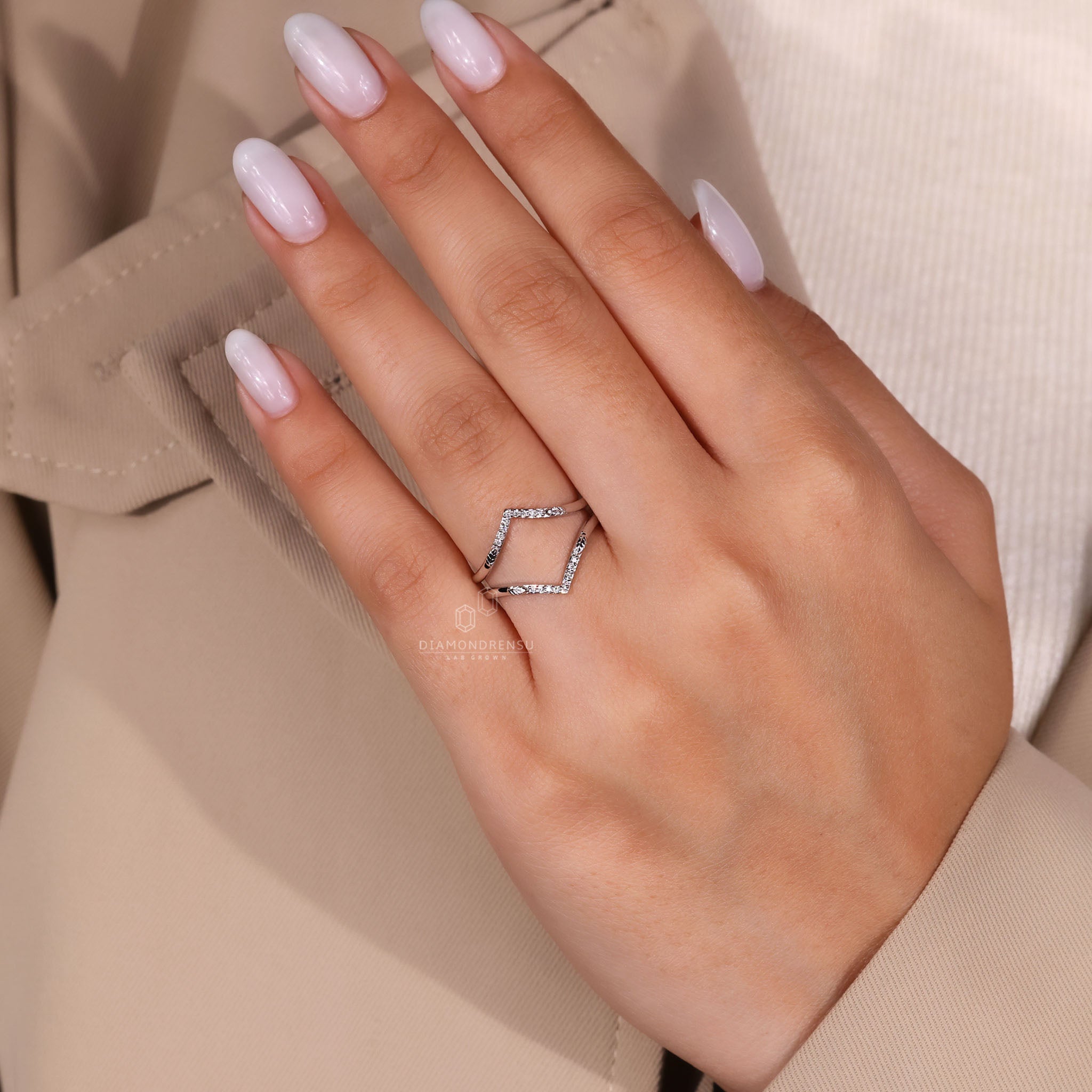Enhancer band with shared prong round diamonds.