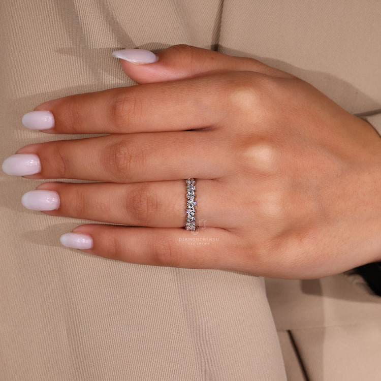 Lab diamond band with teardrop and round stones.