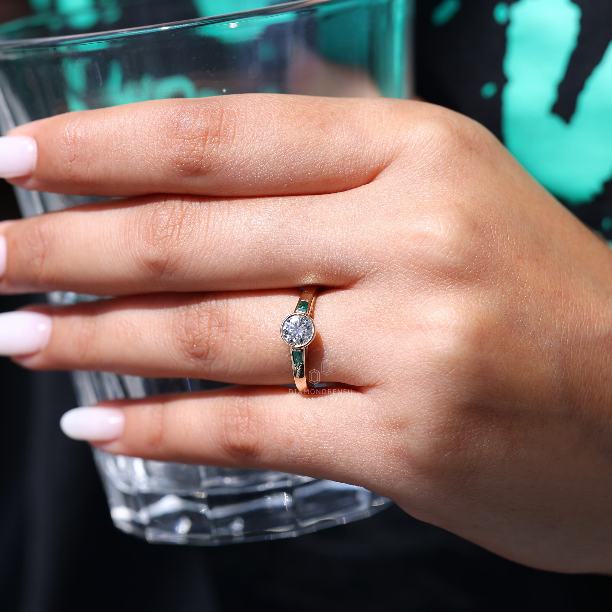 2 Emerald diamond used in bezel three stone engagement ring.
