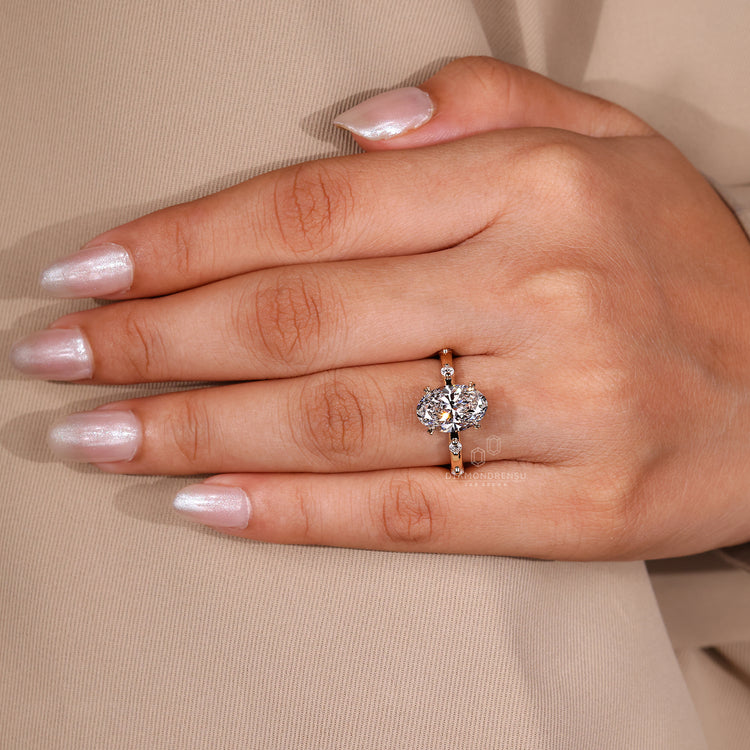 Round cut diamond hidden halo in a cathedral setting.