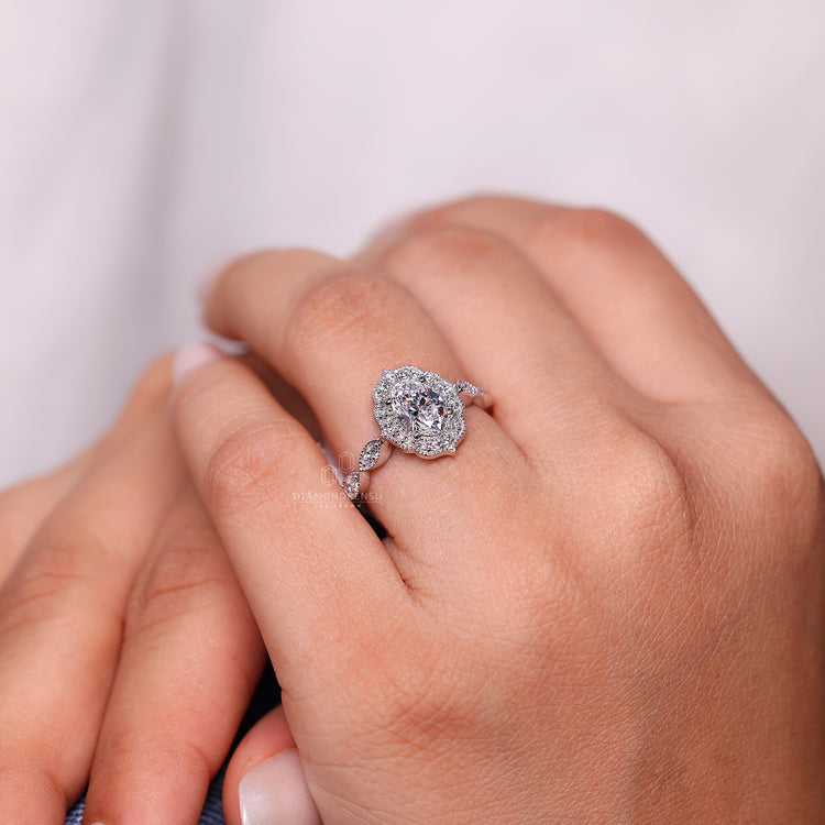 Marquise shape outline with round diamond halo style.