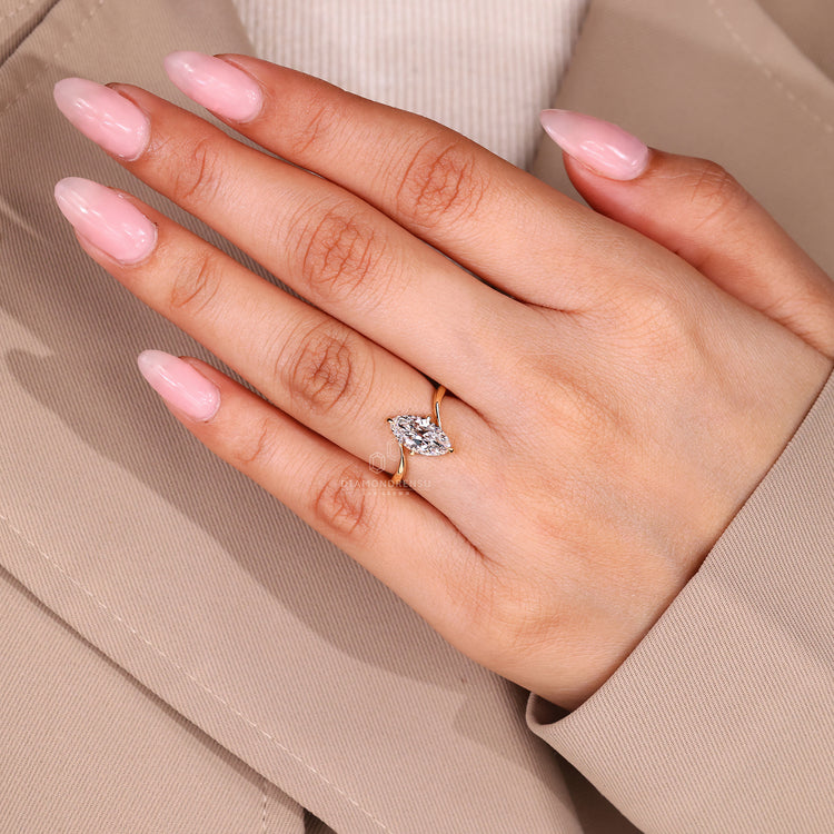 Marquise old european cut diamond ring with handmade compass prong setting.