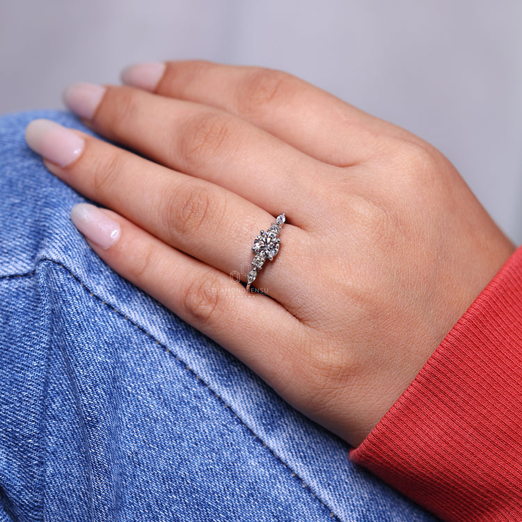 3 round cut diamond ring with tapered shank band.