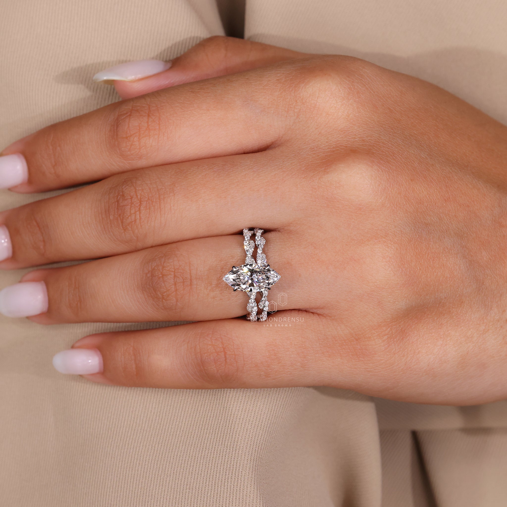 White gold bridal set designed with hidden halo and claw setting.