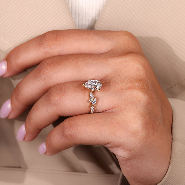 Pear diamond ring with three claw prong setting.