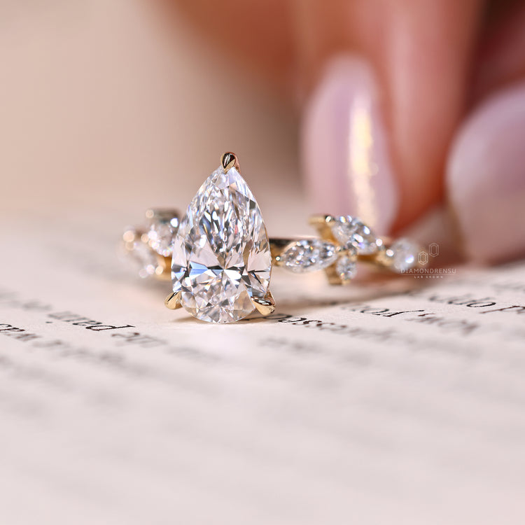 Lab grown pear and marquise diamond ring.