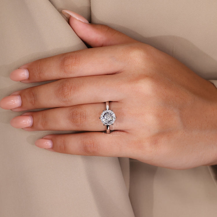 Six claw prong setting used to hold Portuguese cut diamond.