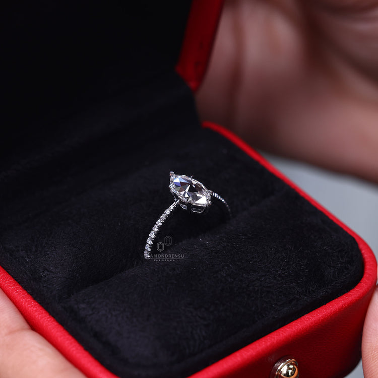 Custom engagement ring with rose cut marquise diamond.