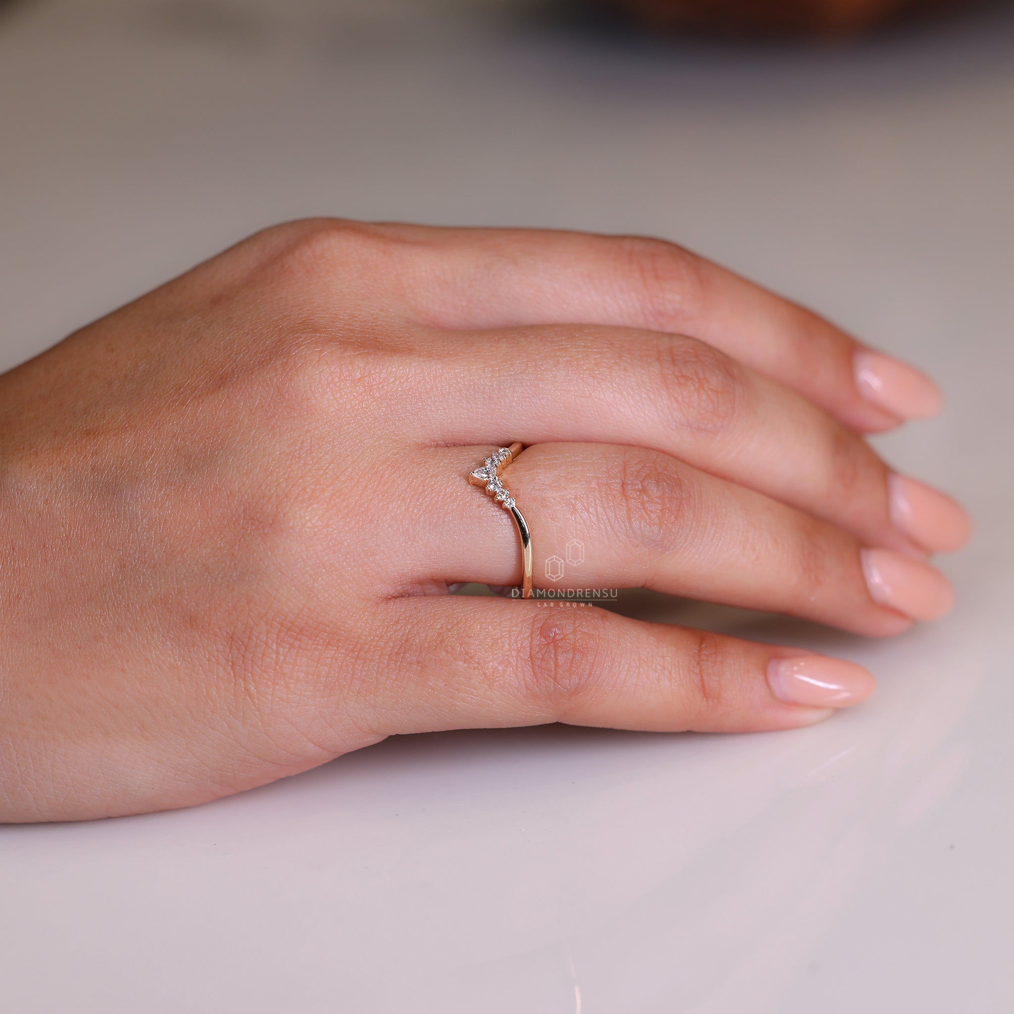 Curved diamond band featuring lab grown diamonds in a clean setting.