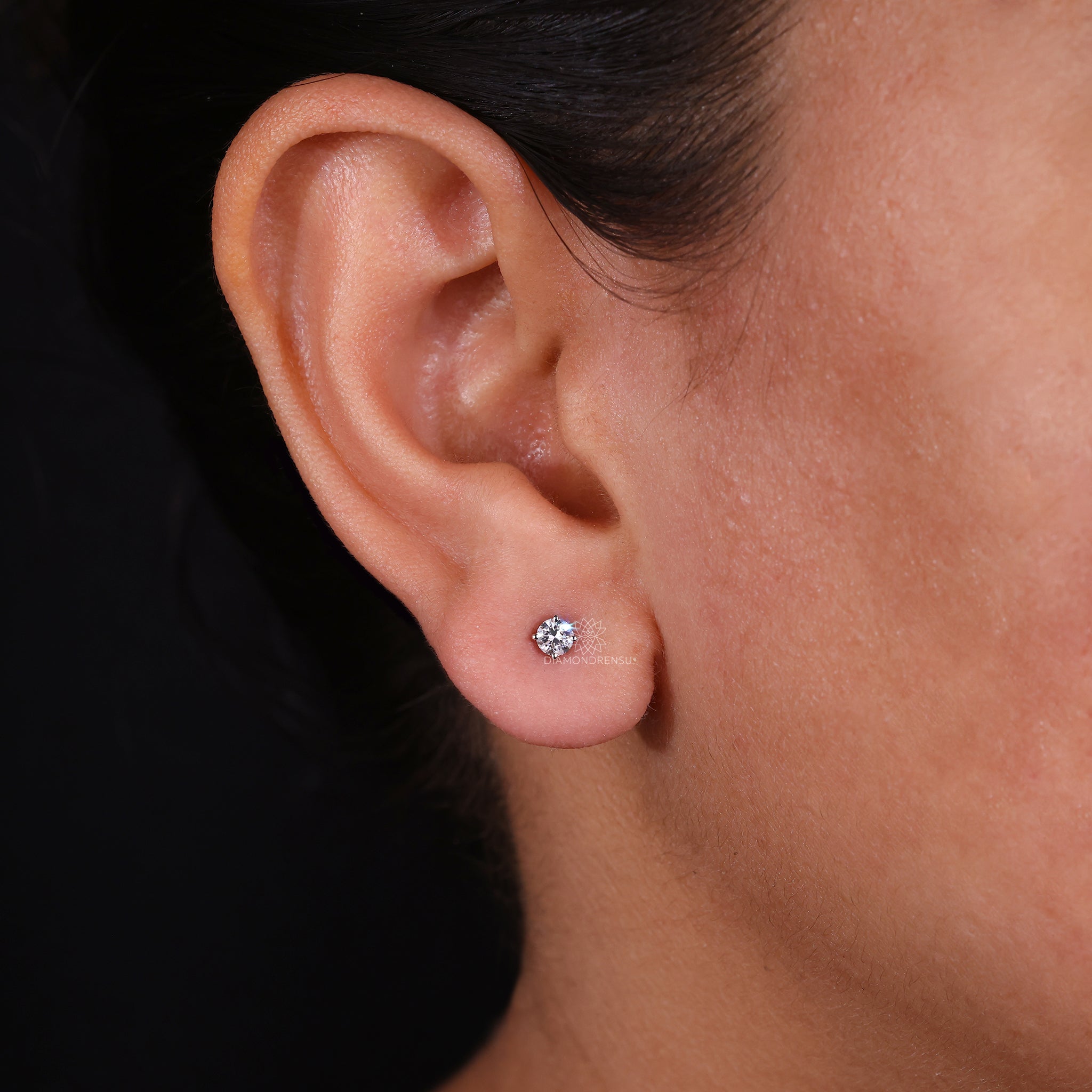 Four prong diamond earrings for women.