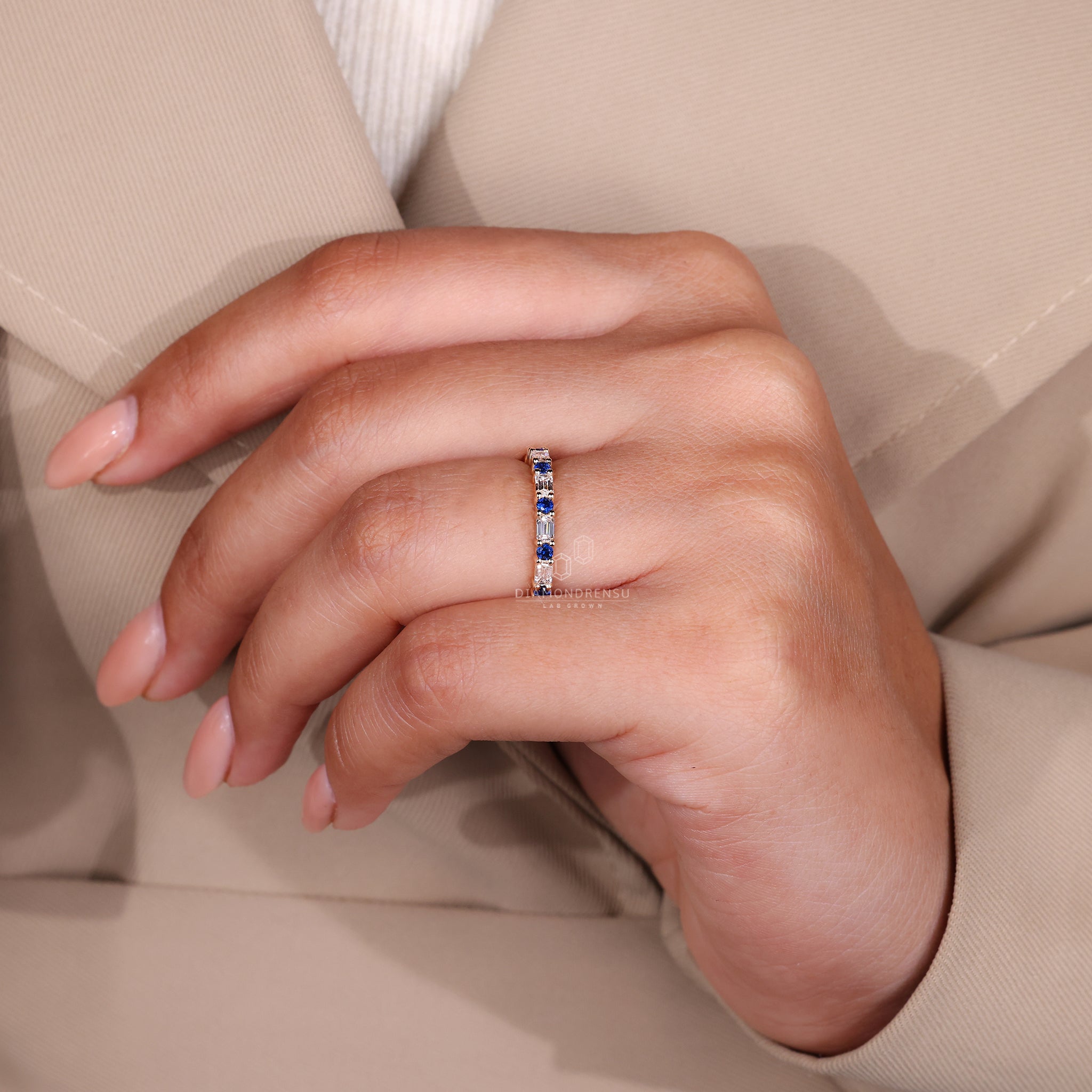 Yellow gold diamond band set with round sapphires in a classic layout