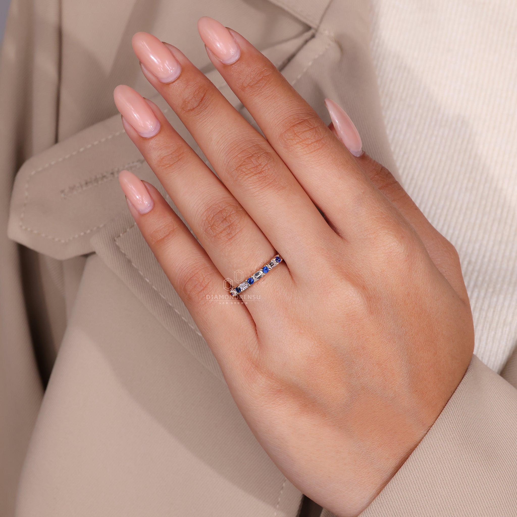 Handmade band with alternating blue sapphires and emerald cut stones.