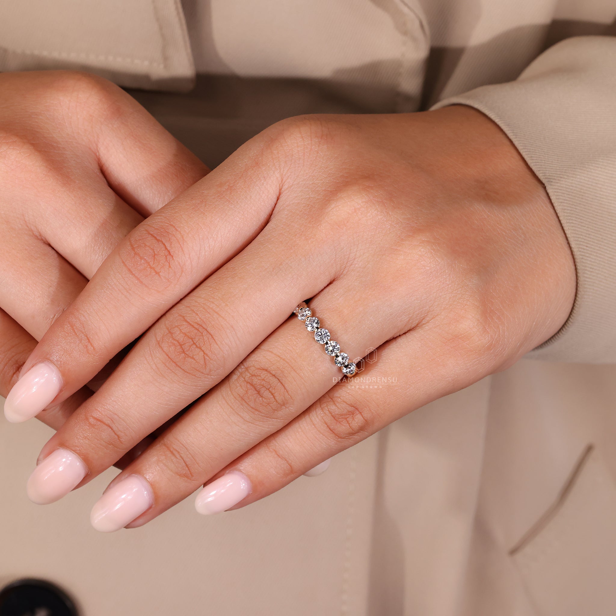 Handmade band crafted with round cut diamonds and simple details.
