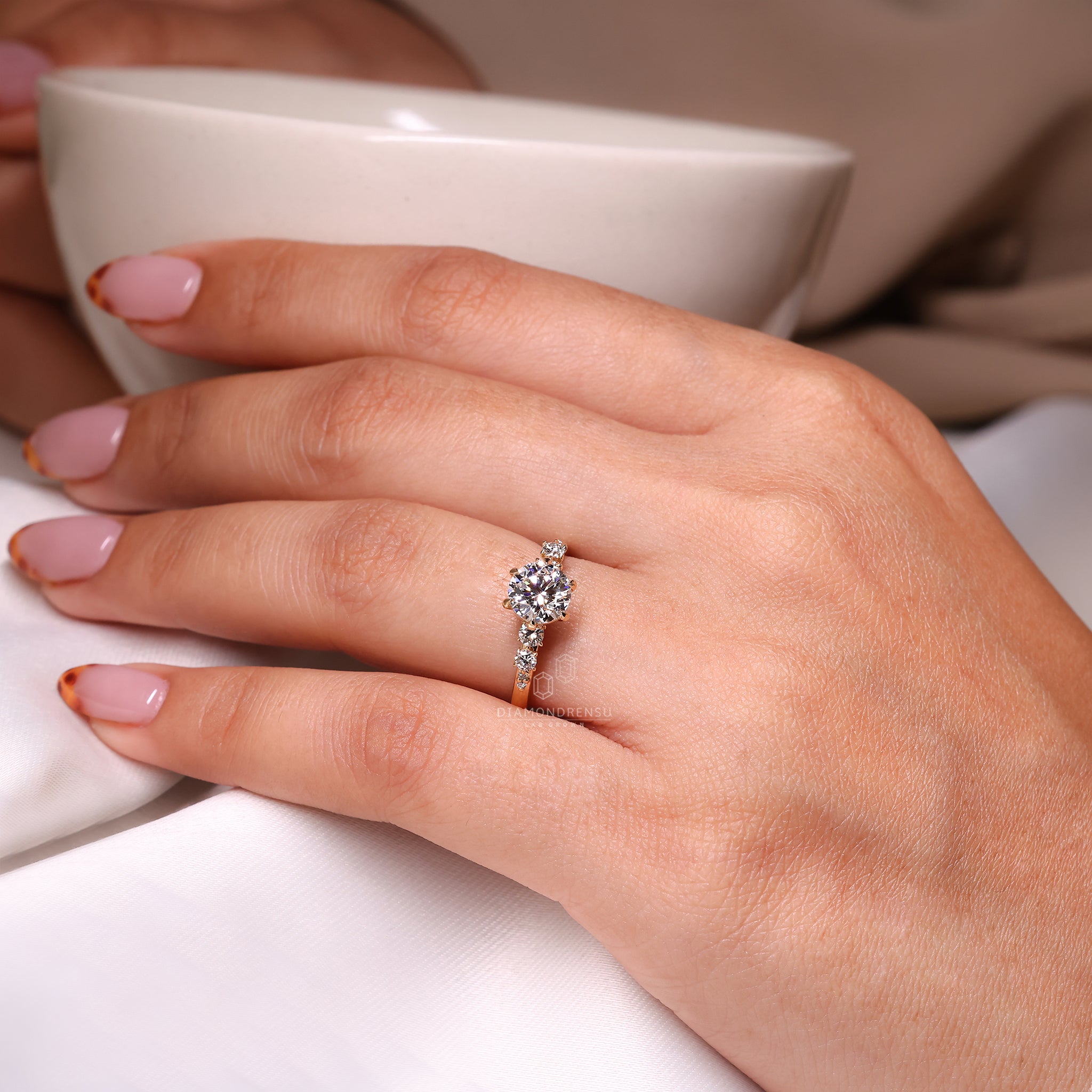 Hidden halo round diamond added under the center setting.