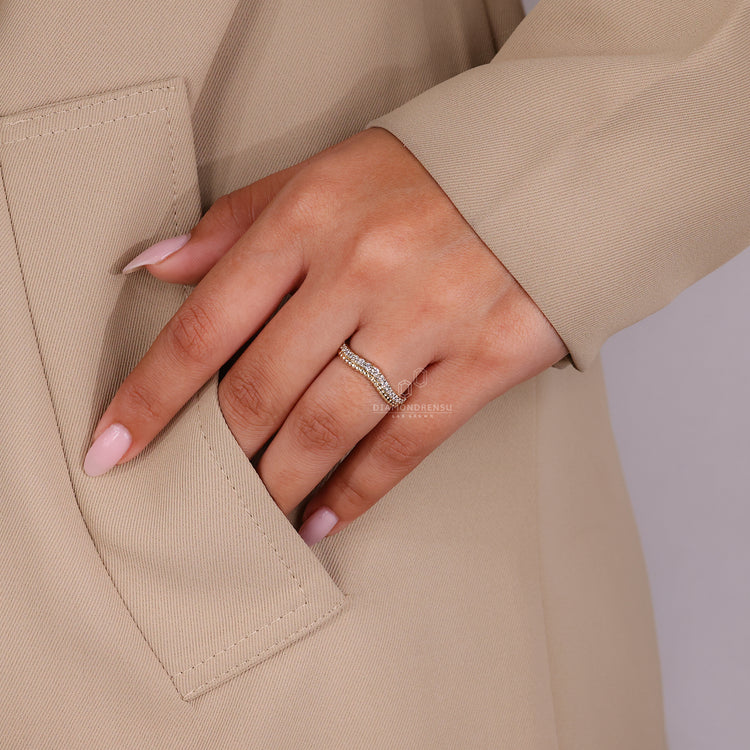 Buy wedding band featuring curved design and milgrain accents.