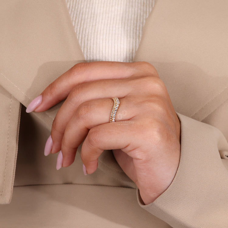 Prong set wedding band with round lab grown diamonds.