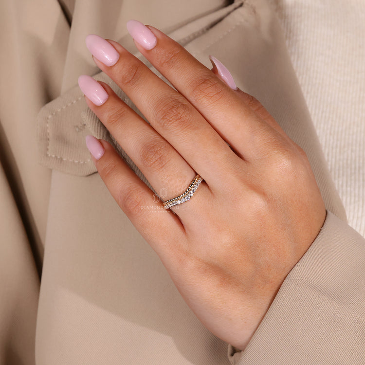 Handmade jewellery showcasing a prong set wedding band.