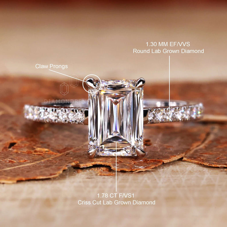 Round Cut Diamond Side Stones accentuating a pave ring diamond with lab grown diamond in an emerald gold ring.