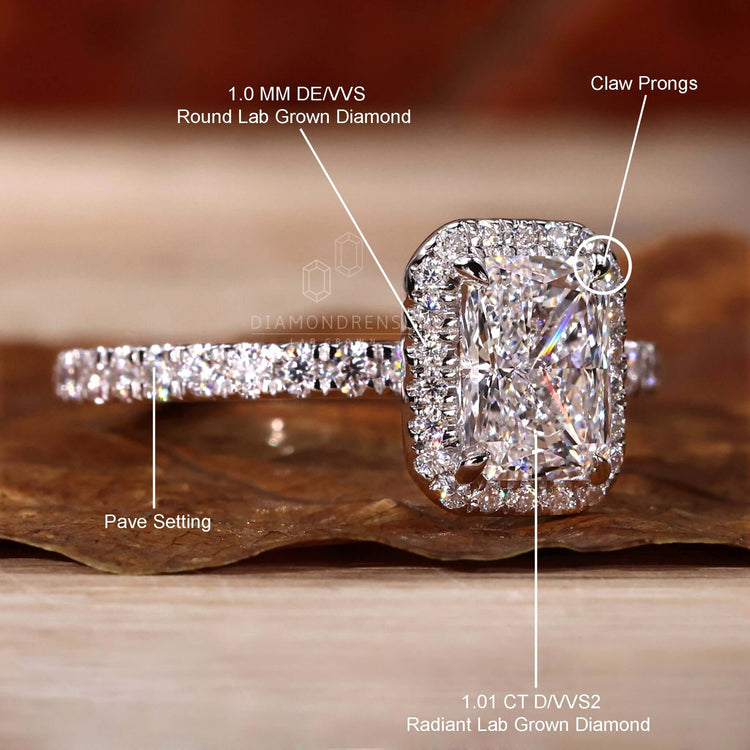 Engagement ring for women with a radiant diamond and handmade jewelry in a halo engagement rings design.