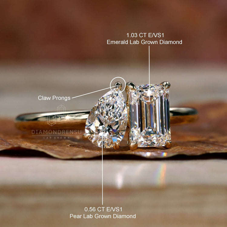 Toi et Moi Diamond Ring with an emerald cut stone and handmade jewelry crafted for elegant engagements in the UK.