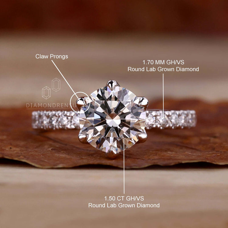 Pave band engagement ring with a round diamond and brilliant cut style, perfect for a classic engagement design.