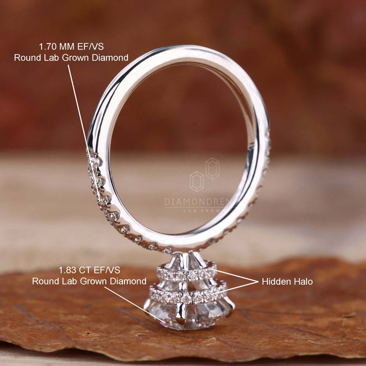 Elegant pave round diamond engagement ring featuring a claw prong setting.