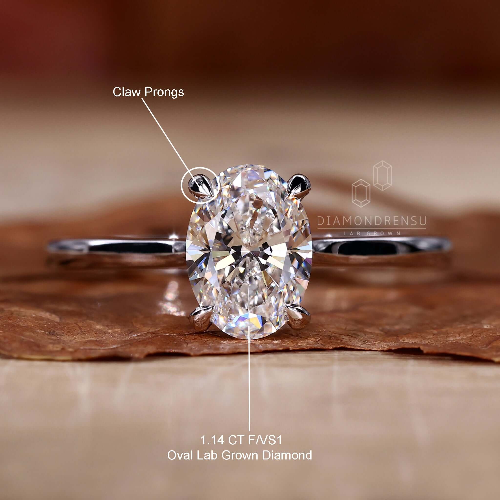Oval cut solitaire ring in claw prong setting, perfect for engagements.
