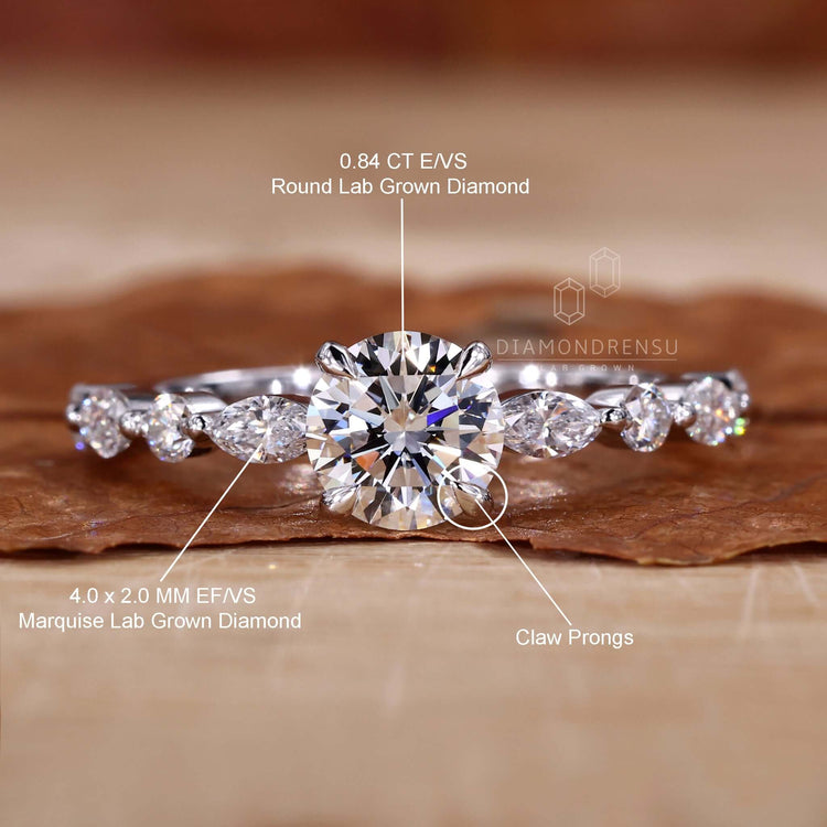 Unique marquise side stone engagement ring with sparkling accents.