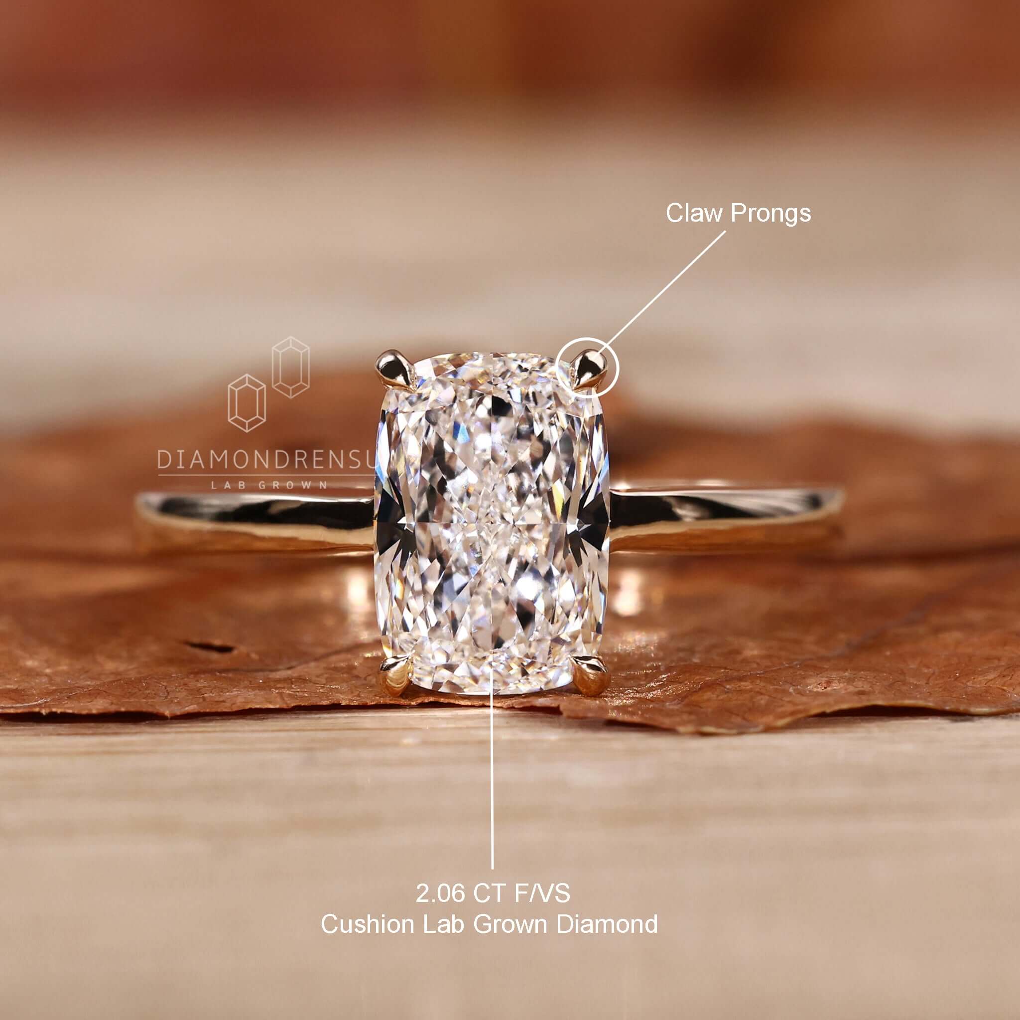Classic solitaire engagement ring with a cushion cut diamond and claw prongs.