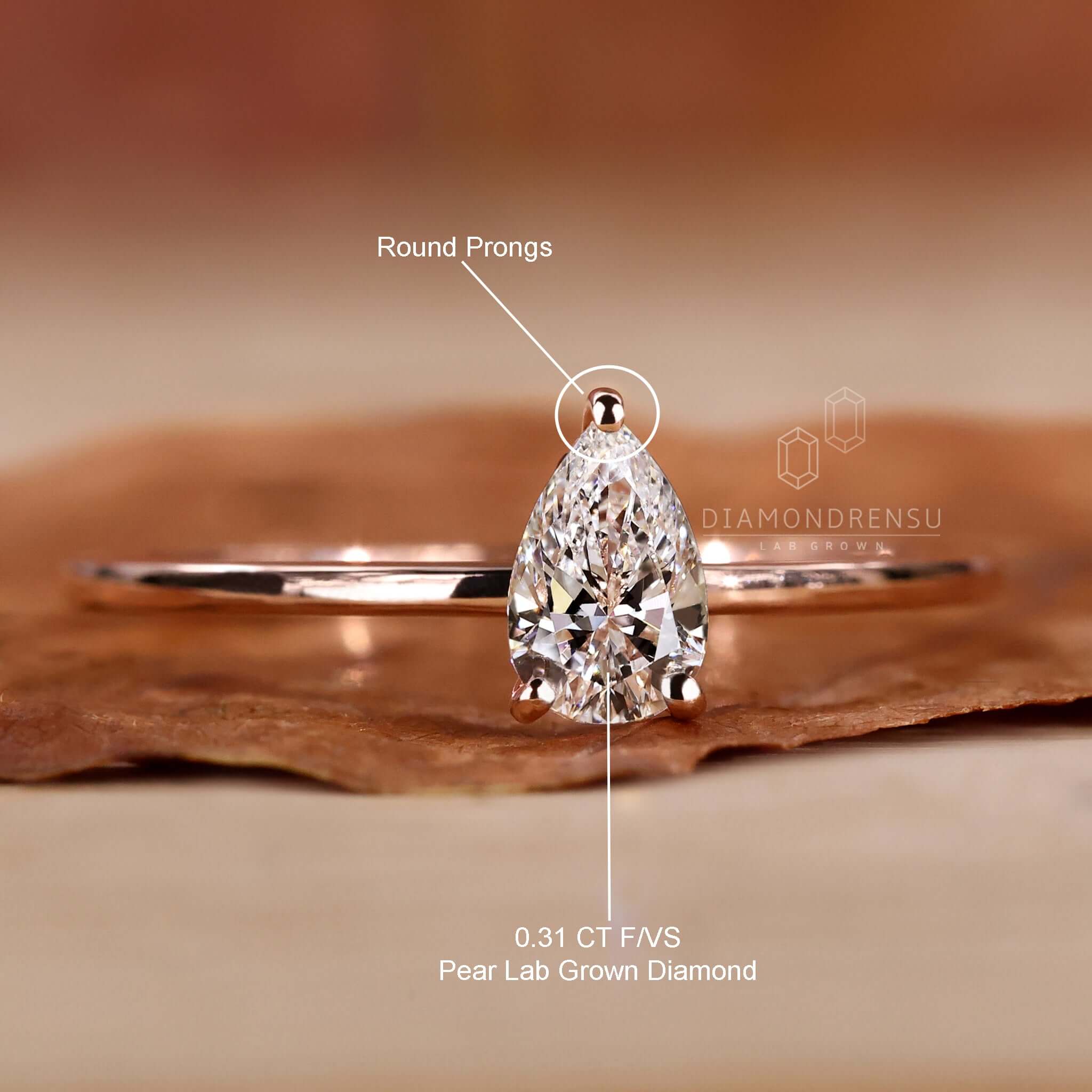 Engagement ring for women with a pear cut diamondrensu UK ring.