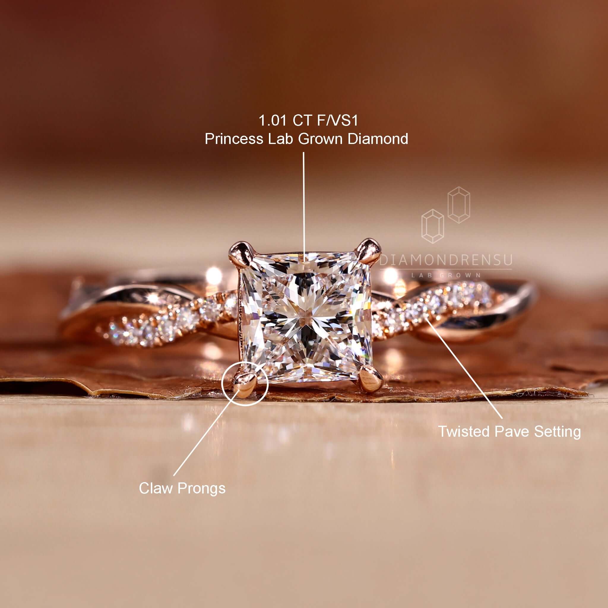 Side stone engagement ring with a lab grown diamond and a twisted pave ring band.