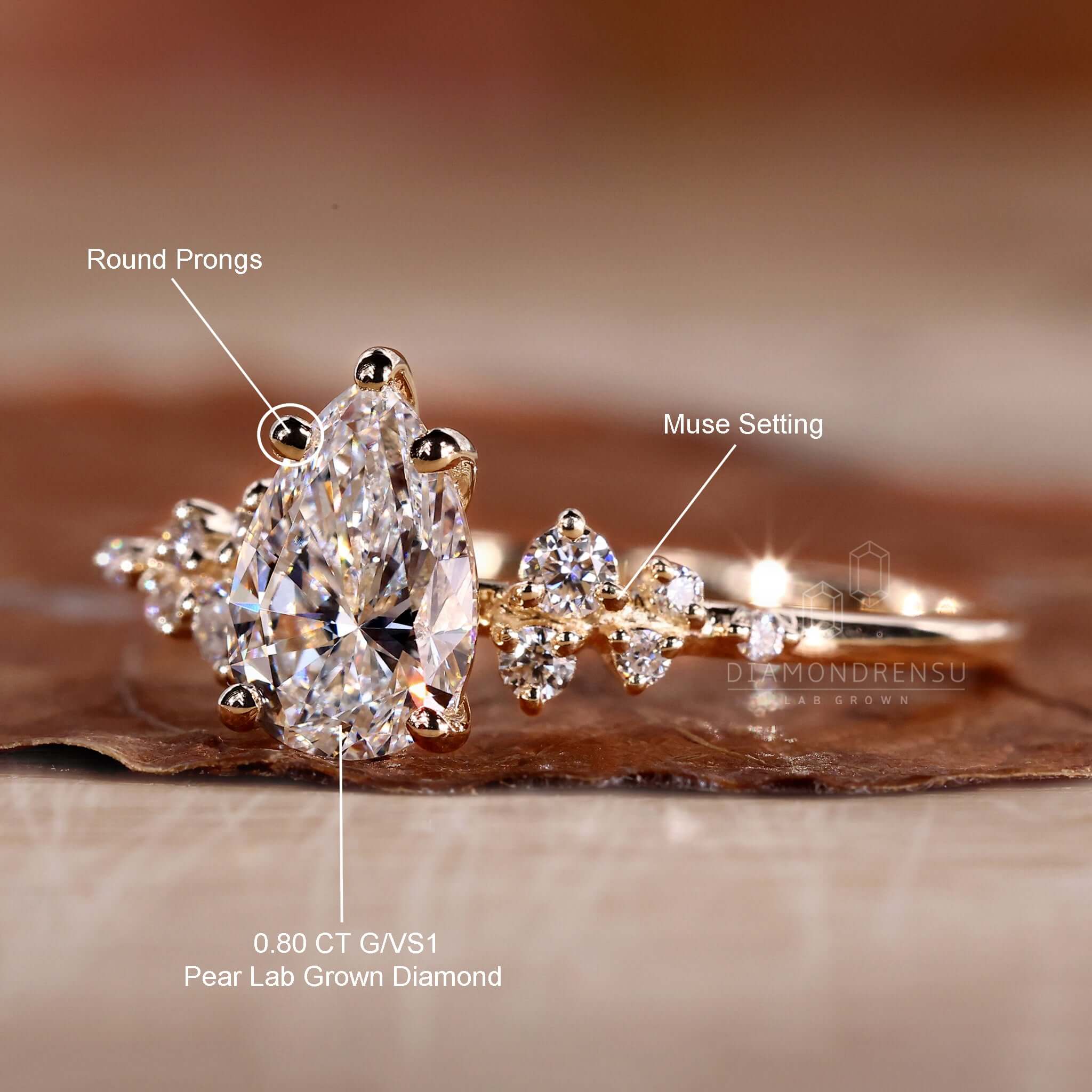 Unique engagement ring crafted with a pear shaped diamond in an igi certified yellow gold setting.