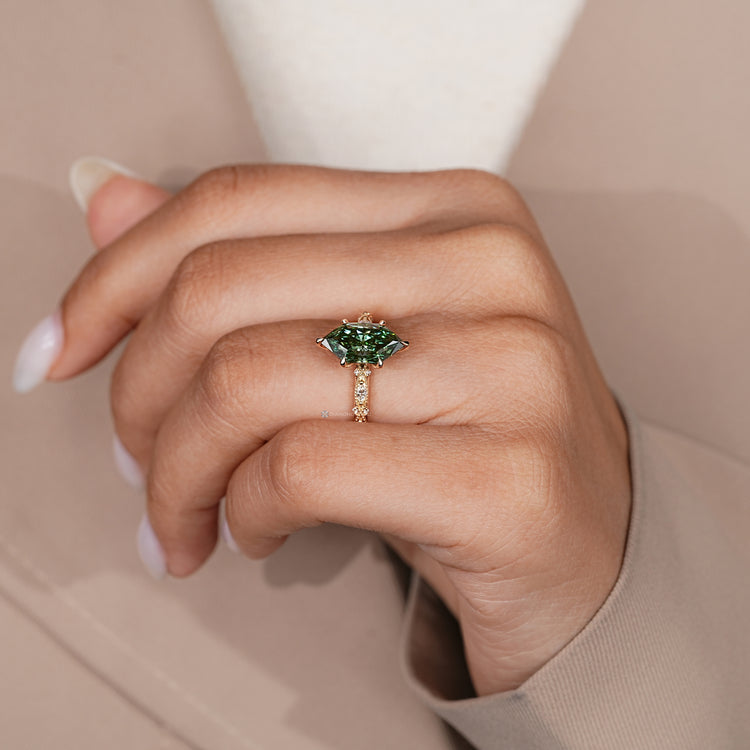 Handmade engagement ring with marquise and round diamonds.