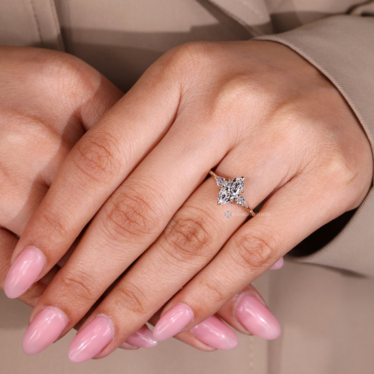 Marquise ring with cathedral setting and tapered shank.