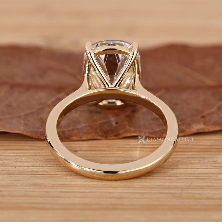 Cushion OMC diamond ring with four claw prong setting.