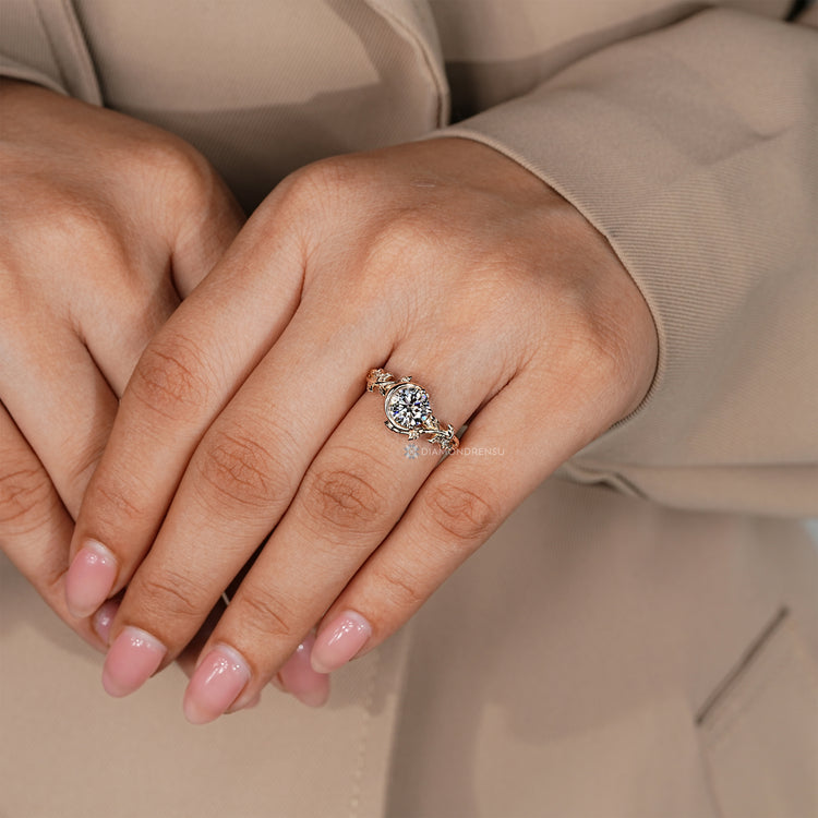 Round cut diamond ring with three prong setting.
