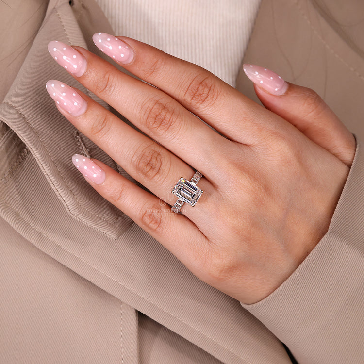 Pavé band emerald cut ring with bar setting.